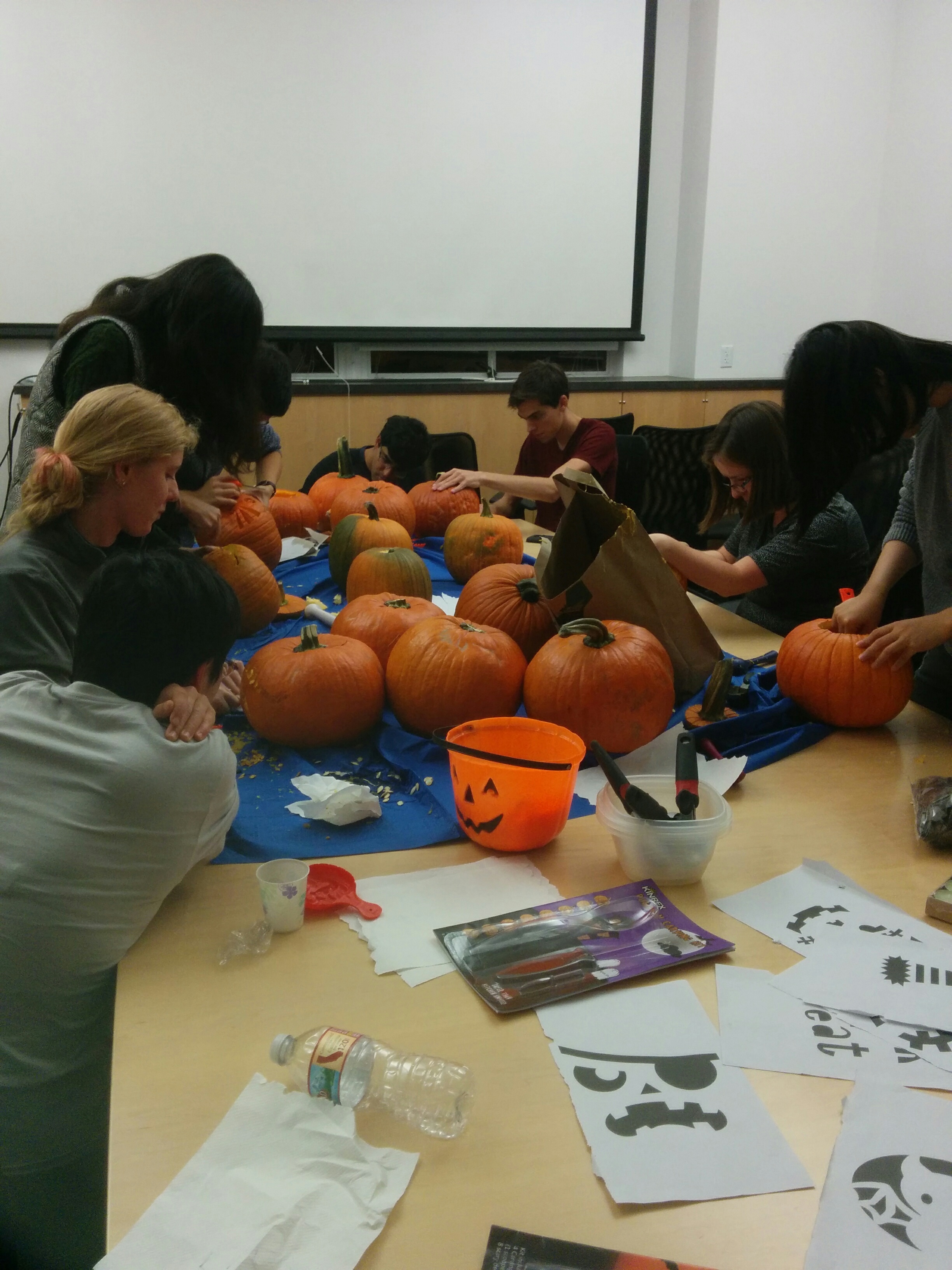 Preparing for Halloween with a pumpkin carving social activity